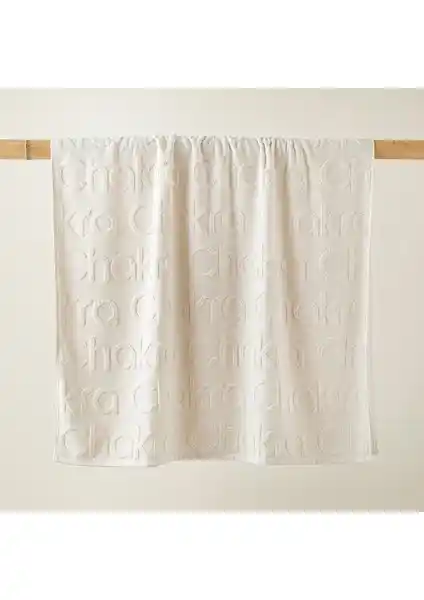 Chakra Logolu Ekru Plaj Havlusu Şıklık ve Konforu Bir Arada Sunar