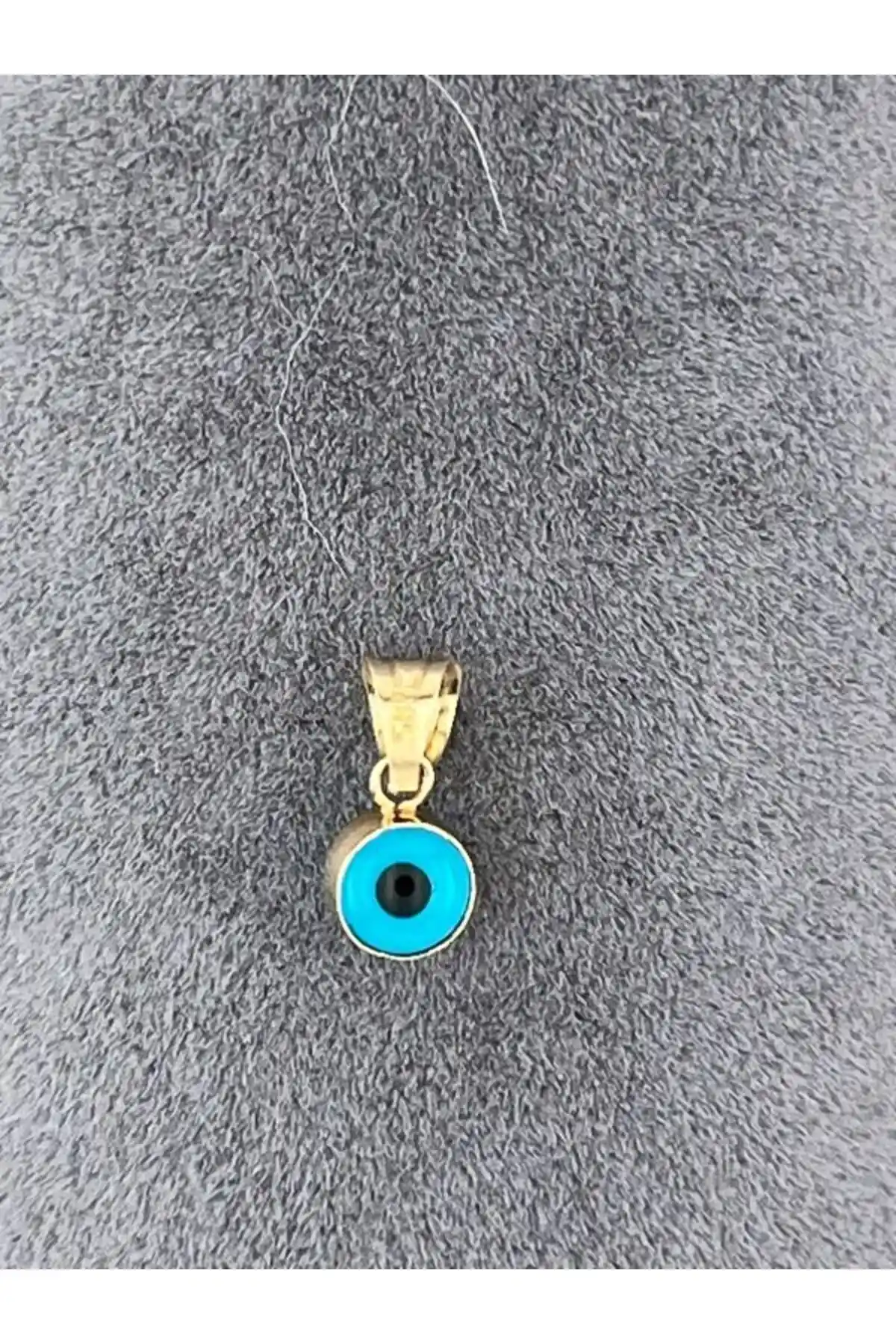 Altın Nazar Boncuğu Ucu Dekorasyonda Şıklık ve Koruma Sağlayan Modern Tasarımlar