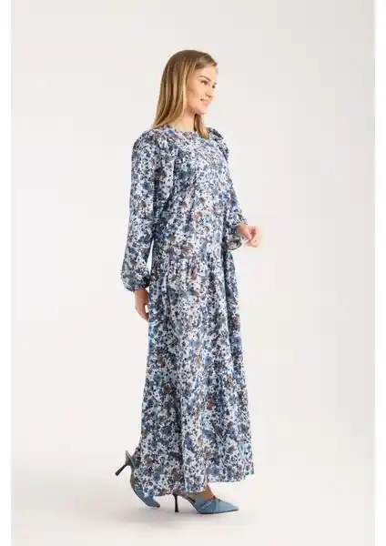 Zarina Büzgülü Elbise: Şıklık ve Konforu Bir Arada Sunan Modern Kadın Giyim Parçası